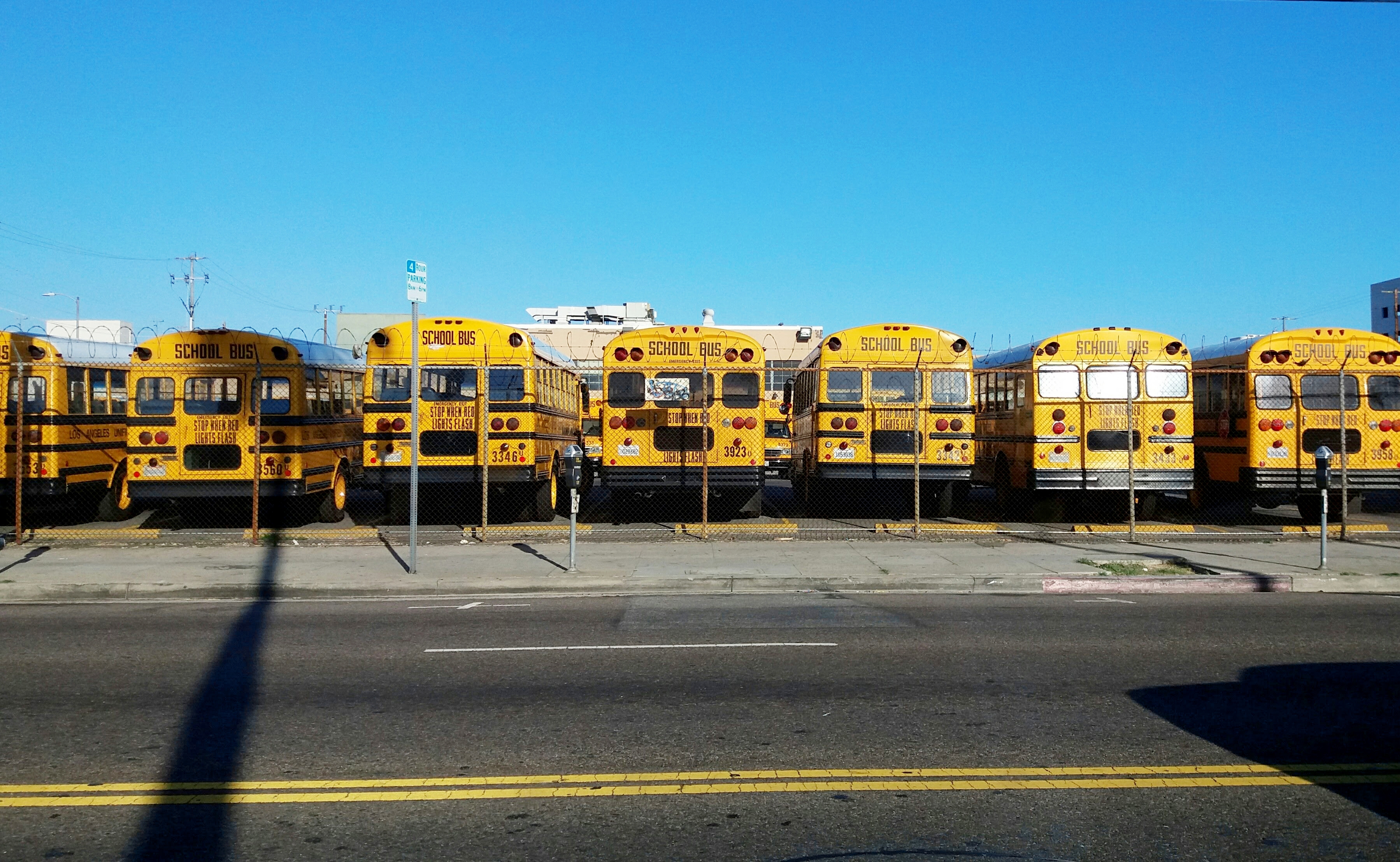 K12 stockphoto fleet of parked buses