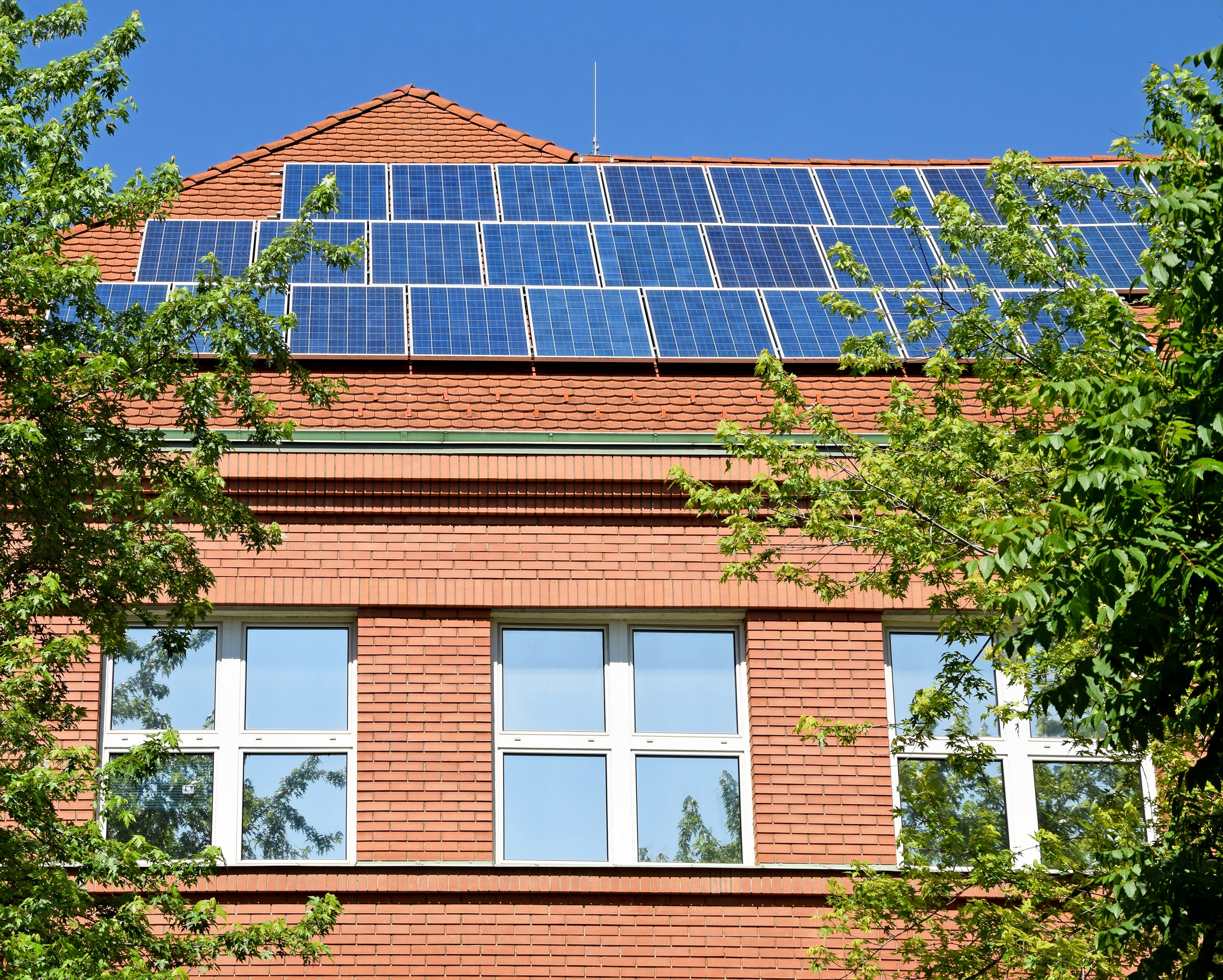 K12 stockphoto school building roof solar panels